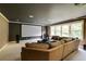 Spacious living room with a large screen, comfortable seating, and lots of windows at 1575 Spalding Dr, Sandy Springs, GA 30350