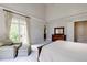 Spacious main bedroom with lots of light, a sitting area and neutral colors at 1575 Spalding Dr, Sandy Springs, GA 30350
