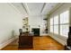 Bright office with hardwood floors, built-in bookshelves, and natural light at 1575 Spalding Dr, Sandy Springs, GA 30350