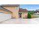 View of the house featuring a two-car garage and welcoming entrance at 202 Accord Sw Ln, Grayson, GA 30017