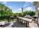 Large outdoor deck features dining and seating areas, 2 grills, and beautiful views at 209 Braemar Ct, Mcdonough, GA 30253