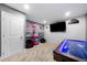 Entertainment area with a TV, snack bar, and air hockey table, providing a relaxed and fun atmosphere at 209 Braemar Ct, Mcdonough, GA 30253