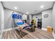 Recreational space with game machines and hardwood floors, perfect for Gathering fun and entertainment at 209 Braemar Ct, Mcdonough, GA 30253