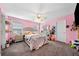 Bedroom featuring a large bed, ceiling fan and a light pink walls at 209 Braemar Ct, Mcdonough, GA 30253