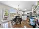 Eat-in kitchen with white cabinets, stainless steel appliances and a center island at 209 Braemar Ct, Mcdonough, GA 30253