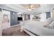 Comfortable main bedroom features trey ceiling, ceiling fan, TV, and doorway to another room at 209 Braemar Ct, Mcdonough, GA 30253