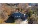 Aerial view of home nestled in wooded area near the river at 3212 Woodhaven Sw Ct, Conyers, GA 30094