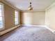 Spacious bedroom with plush carpeting, neutral paint, and double windows providing natural light at 3212 Woodhaven Sw Ct, Conyers, GA 30094