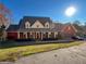Expansive two-story brick home with a three-car garage and well-maintained landscaping at 3212 Woodhaven Sw Ct, Conyers, GA 30094