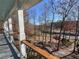 Porch with wooden railing and a view of the river and fall foliage at 3212 Woodhaven Sw Ct, Conyers, GA 30094