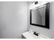 Modern half-bathroom with sleek vanity, stylish fixtures, and a contemporary mirror at 3407 Spring Harbour Dr # 2, Doraville, GA 30340