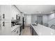 Spacious kitchen featuring stainless steel appliances, white cabinets, and quartz countertops at 3407 Spring Harbour Dr # 2, Doraville, GA 30340
