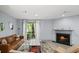 Inviting living room featuring a fireplace, comfortable seating, and access to the outdoors at 3407 Spring Harbour Dr # 2, Doraville, GA 30340