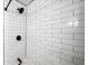 Modern shower with white subway tile, black fixtures, and a sleek design at 3407 Spring Harbour Dr # 2, Doraville, GA 30340