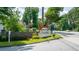 Entrance sign of 'Spring Harbor' with well-manicured landscaping and street view at 3407 Spring Harbour Dr # 2, Doraville, GA 30340