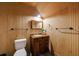 Charming bathroom featuring wood paneling, classic fixtures, and a cozy atmosphere at 4500 Candacraig, Alpharetta, GA 30022
