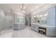 Spacious bathroom featuring double vanities, marble floors, walk-in glass shower, and custom lighting at 4500 Candacraig, Alpharetta, GA 30022