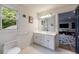 Bright bathroom featuring a double sink vanity, modern fixtures, and lots of light at 4500 Candacraig, Alpharetta, GA 30022