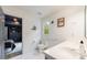 Bright bathroom features a white vanity, toilet, hexagon tile floors, and decor at 4500 Candacraig, Alpharetta, GA 30022