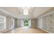 Spacious bedroom with decorative wallpaper, tray ceilings, and lots of natural light at 4500 Candacraig, Alpharetta, GA 30022