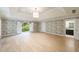 Large primary bedroom with decorative wallpaper, tray ceilings, and access to the bathroom at 4500 Candacraig, Alpharetta, GA 30022