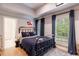 Bedroom showcasing a bed, natural light, hardwood floors, and tasteful decor at 4500 Candacraig, Alpharetta, GA 30022
