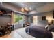 Comfortable bedroom featuring a gray color scheme, tray ceiling, and natural light at 4500 Candacraig, Alpharetta, GA 30022