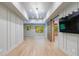 Spacious bonus room with light walls, hardwood floors, and a view of the lush greenery outside at 4500 Candacraig, Alpharetta, GA 30022