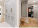 Custom built-in closet with gray cabinetry, brass hardware, and organized shelving at 4500 Candacraig, Alpharetta, GA 30022
