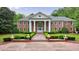 Stately brick home featuring manicured landscaping and a columned entrance at 4500 Candacraig, Alpharetta, GA 30022