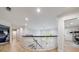 Upstairs hallway with hardwood floors, custom railing, and access to bedrooms at 4500 Candacraig, Alpharetta, GA 30022