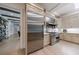 Eat-in kitchen boasts high-end appliances and custom cabinetry with a view of the living room at 4500 Candacraig, Alpharetta, GA 30022