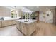 Large kitchen with marble island, custom cabinets, and skylight offering natural light at 4500 Candacraig, Alpharetta, GA 30022