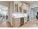 Modern kitchen featuring custom cabinetry, stainless steel appliances, and a sleek beverage center at 4500 Candacraig, Alpharetta, GA 30022