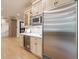 Beautiful kitchen featuring custom cabinets, stainless steel appliances, and sleek beverage fridge at 4500 Candacraig, Alpharetta, GA 30022