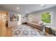 Comfortable living room with sofa, large area rug, natural light, and decor at 4500 Candacraig, Alpharetta, GA 30022