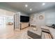 Bright living room featuring a large TV, ample seating, and shiplap walls at 4500 Candacraig, Alpharetta, GA 30022