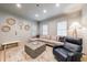 Comfortable living room with shiplap walls, natural lighting, and a stylish rug at 4500 Candacraig, Alpharetta, GA 30022
