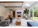 Bright living room with wooden beams, large windows, and comfortable seating at 4500 Candacraig, Alpharetta, GA 30022