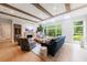 Bright living room with wooden beams, large windows, and comfortable seating at 4500 Candacraig, Alpharetta, GA 30022