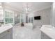 Elegant main bathroom with soaking tub, dual vanities, and marble flooring at 4500 Candacraig, Alpharetta, GA 30022