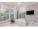 Bright main bathroom with soaking tub, dual vanities, and modern fixtures at 4500 Candacraig, Alpharetta, GA 30022