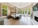 Luminous main bedroom suite with floor-to-ceiling windows, fireplace, and luxurious finishes at 4500 Candacraig, Alpharetta, GA 30022