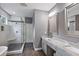 Modern bathroom featuring a glass-enclosed shower, gray walls, dual sinks, and granite countertops at 1740 Bouldercrest Se Rd, Atlanta, GA 30316
