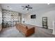 Versatile bonus room features stylish wallpaper and a cozy seating area, perfect for relaxation or entertaining guests at 1740 Bouldercrest Se Rd, Atlanta, GA 30316