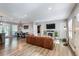 Open-concept living area with hardwood floors, fireplace, and ample natural light creates a warm and inviting atmosphere at 1740 Bouldercrest Se Rd, Atlanta, GA 30316