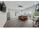 Bright living area with a comfortable sofa, large windows, and modern decor creates a welcoming and stylish gathering space at 1740 Bouldercrest Se Rd, Atlanta, GA 30316