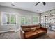 Inviting living area with access to a balcony and featuring custom wallpaper, merging indoor comfort with outdoor views at 1740 Bouldercrest Se Rd, Atlanta, GA 30316