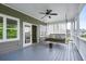 Relaxing porch with a swing and ceiling fan, perfect for enjoying the outdoors in comfort and style at 1740 Bouldercrest Se Rd, Atlanta, GA 30316