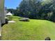Spacious backyard offering outdoor relaxation with a patio set and a trampoline at 2436 Moultrie Ct, Dacula, GA 30019